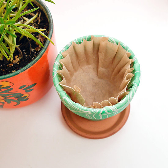Use coffee filters to retain water in your flower pots.