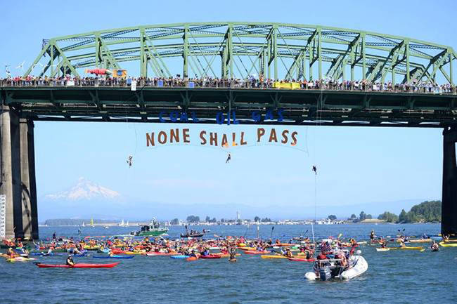 16.) Residents of Portland protest the transportation of coal, gas, and oil.