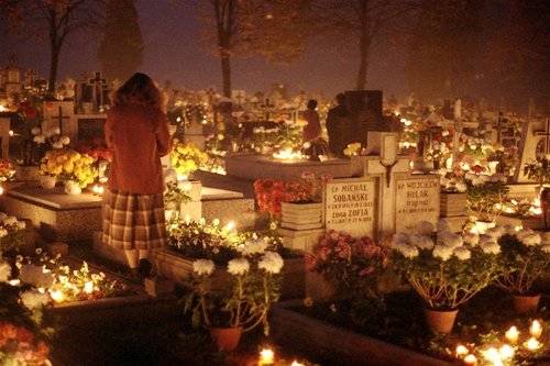 Graveyards in bigger towns are so crowded, the light from the candles makes it look like a Christmas party.