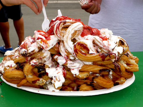 3.) Mexican Funnel Cake (Churros, Whipped Cream, Chocolate Sauce, Strawberries)
