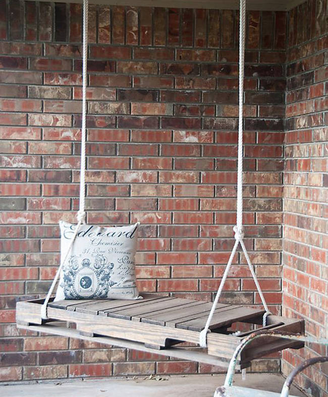 Relax on your patio with this pallet porch swing.