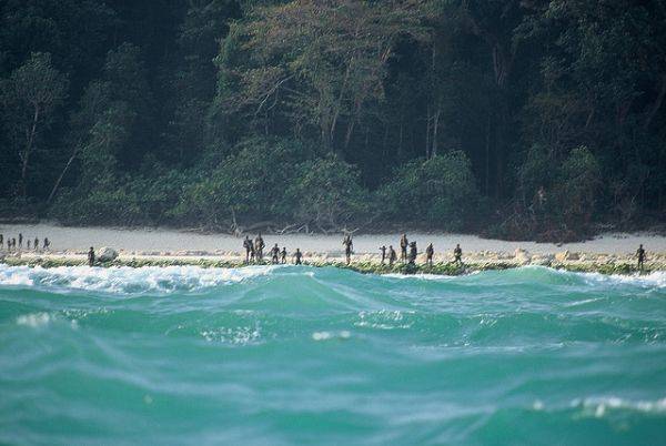 Technically, India has sovereignty over North Sentinel Island. However, after several failed attempts to make friendly contact with them since 1964, the Indian government has finally backed away. All visits to the island are banned. The Indian Navy has enforced a 3-mile buffer zone to keep tourists, explorers and other meddlers away.