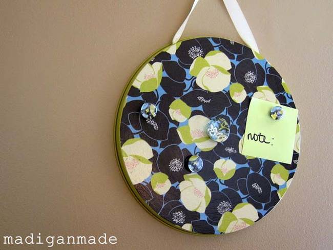 15.) Paint a burner cover and hang with a ribbon for a fun <a href="https://www.madiganmade.com/2011/01/magnetic-memo-boards-made-from-dollar.html" target="_blank">hanging magnetic board</a>.