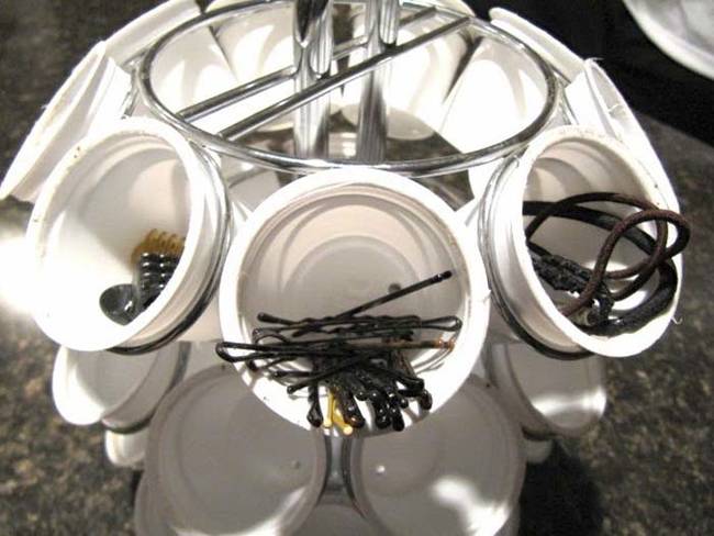 A K-cup holder, plus some empty K-cups, makes a great hair accessory organizer.