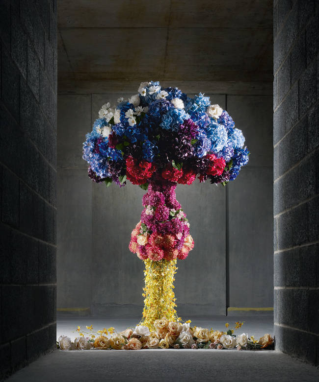 Flowers are signs of life and newness, but also commonly found at funerals and memorials. This sculpture is also a play on the classic vase shape.