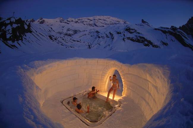 This looks like an awesome vacation spot. A hot tub inside of a roofless igloo seems like a pretty good place to relax.