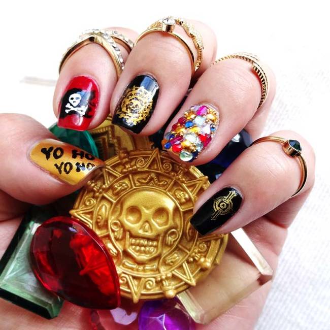 This pirate themed manicure sparkles and shines.