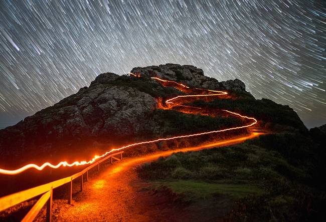 A red headlamp goes for a walk at night