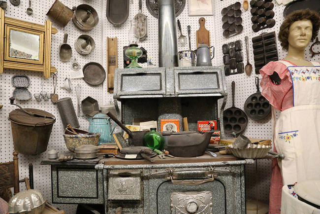 Cookware from various periods, complete with a stylish apron.