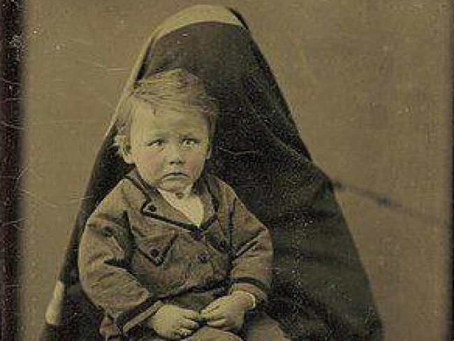 This little boy looks like he was simply terrified into submission.