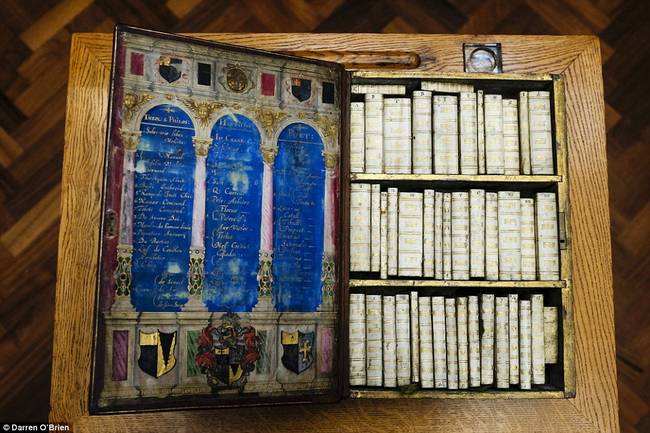 But when opened, three shelves of miniature texts are revealed.