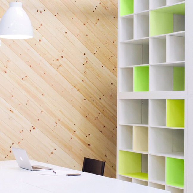 8.) Give your large shelves some <a href="https://www.flaxandtwine.com/2014/06/kallax-ikea-hack-neon-yellow-panyl/" target="_blank">pops of color</a>.