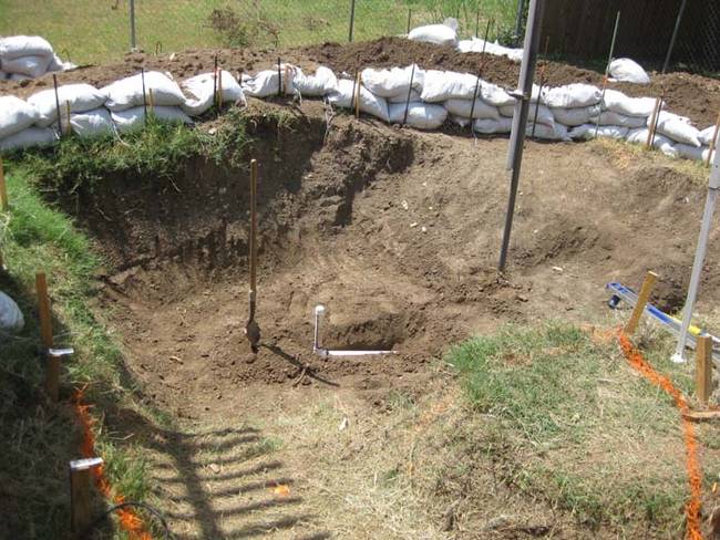 He leveled and marked the edges of the pool for a rough estimate.