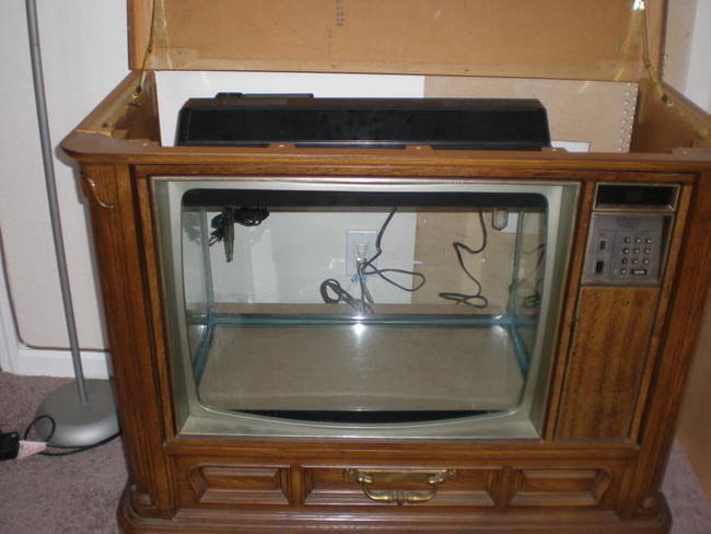 After gathering the necessary supplies for the job, he then went to work on waterproofing and converting the inside of the old television to an operational fish tank.