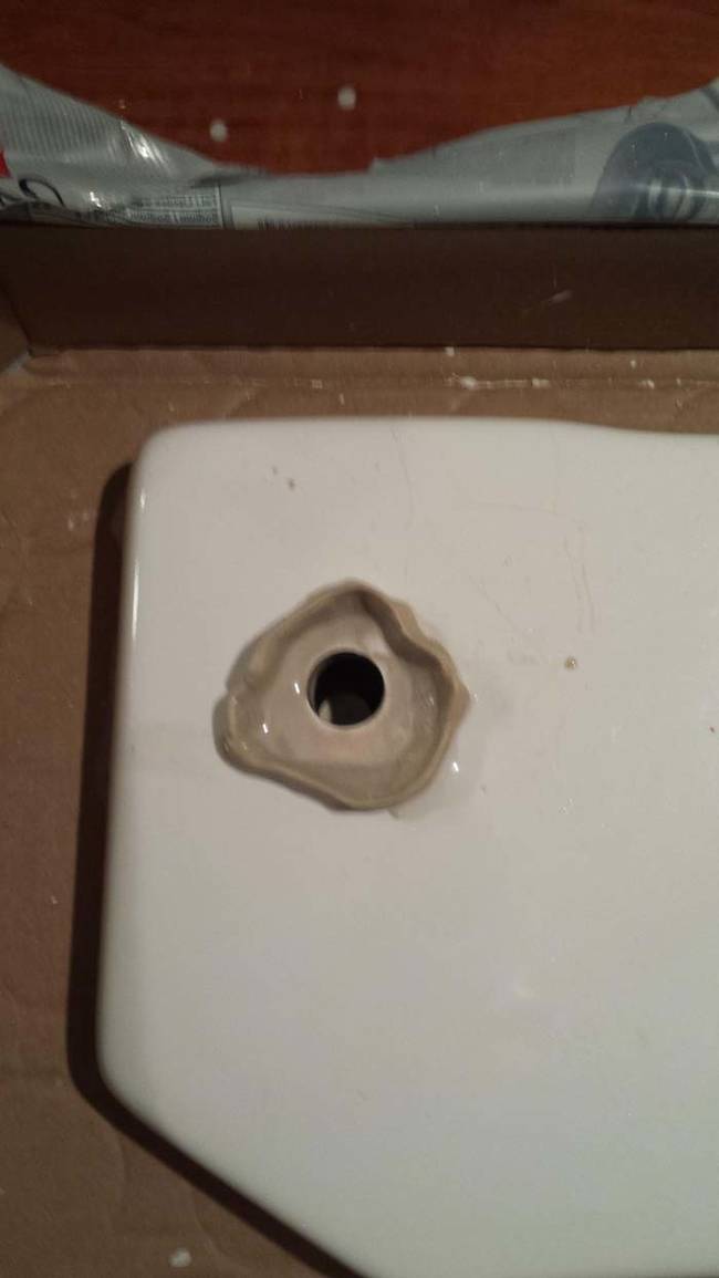 Since the drill bit gets hot, they made a dam with plumber's putty and filled it with water before drilling the hole.