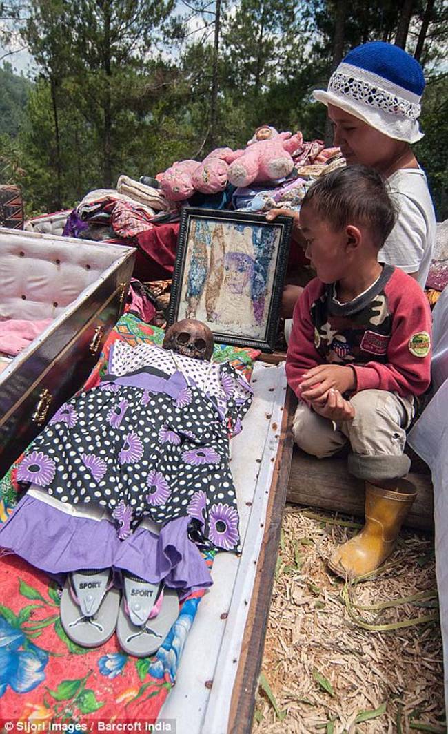 Even the bodies of children are exhumed and redressed during the ceremony.