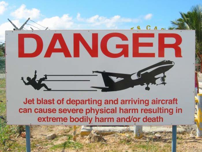 The nearby airport warns tourists that the jet engines may result in physical harm (and/or death)...