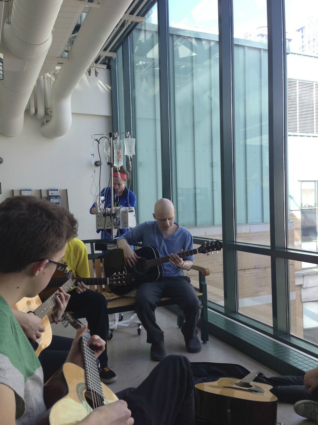 Michael rocking out with friends during his last round of chemo.