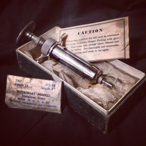 13.) Vintage syringe kit.