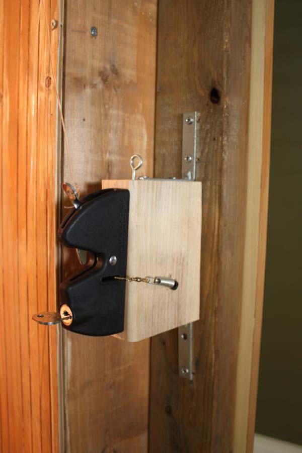 The mechanism used for the door was a normal gate latch (it could be locked from the inside).