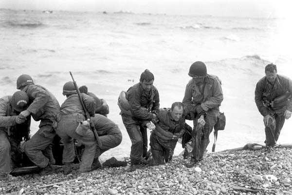 A US landing craft was sunk off the coast and other troops are helping them to shore.