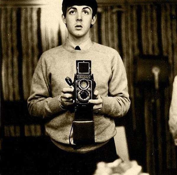 34.) Paul McCartney takes a mirror selfie (1959).