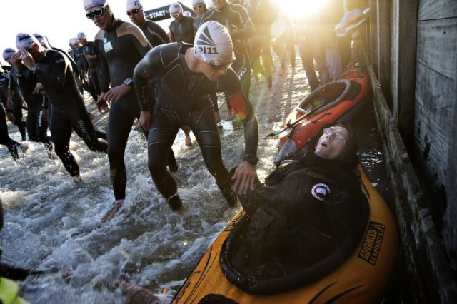 The race beings with a 3.8 KM swim. Steen pulls Peder along with him in a raft.