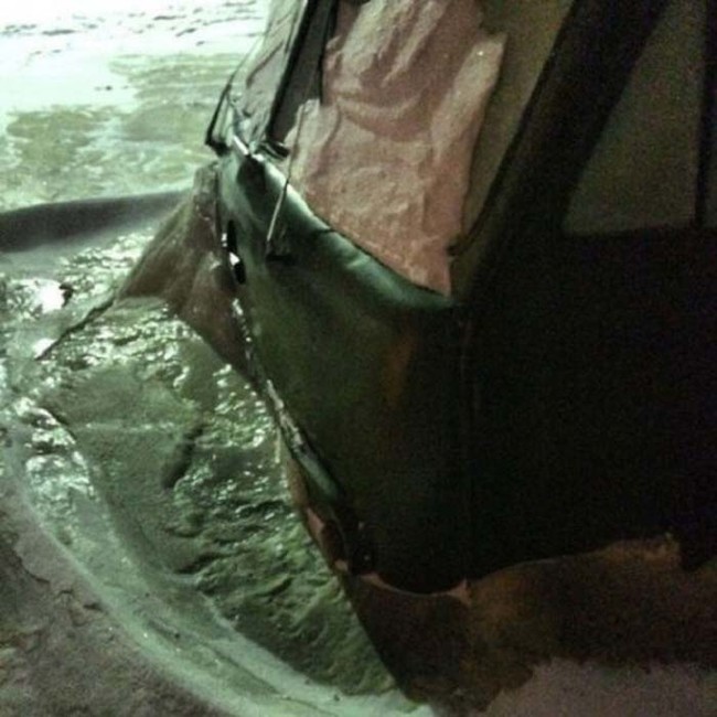 Cars were frozen solid in 4-foot thick blocks of ice.