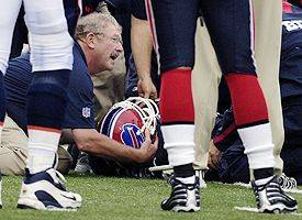 A football player walks after a devastating spinal injury