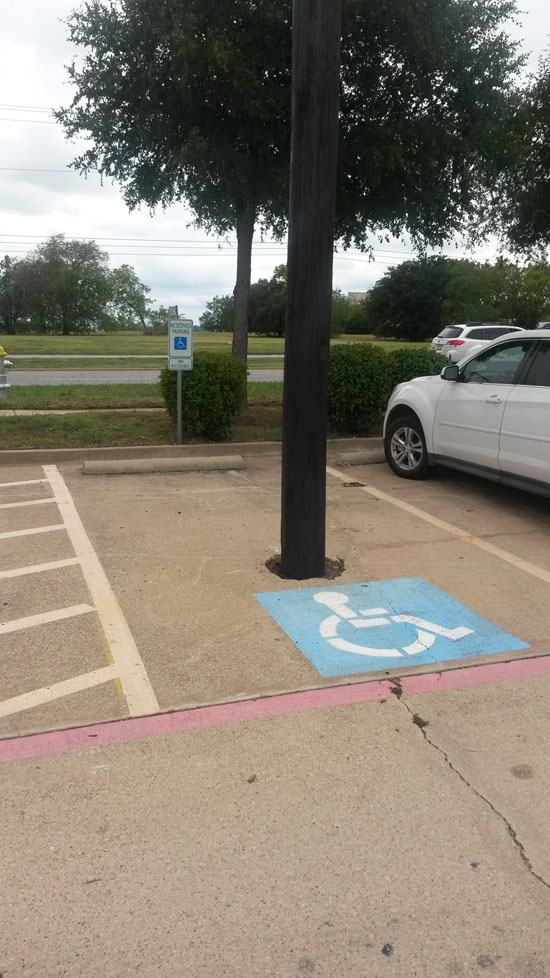 28.) This parking lot is making handicap parking available wrong.