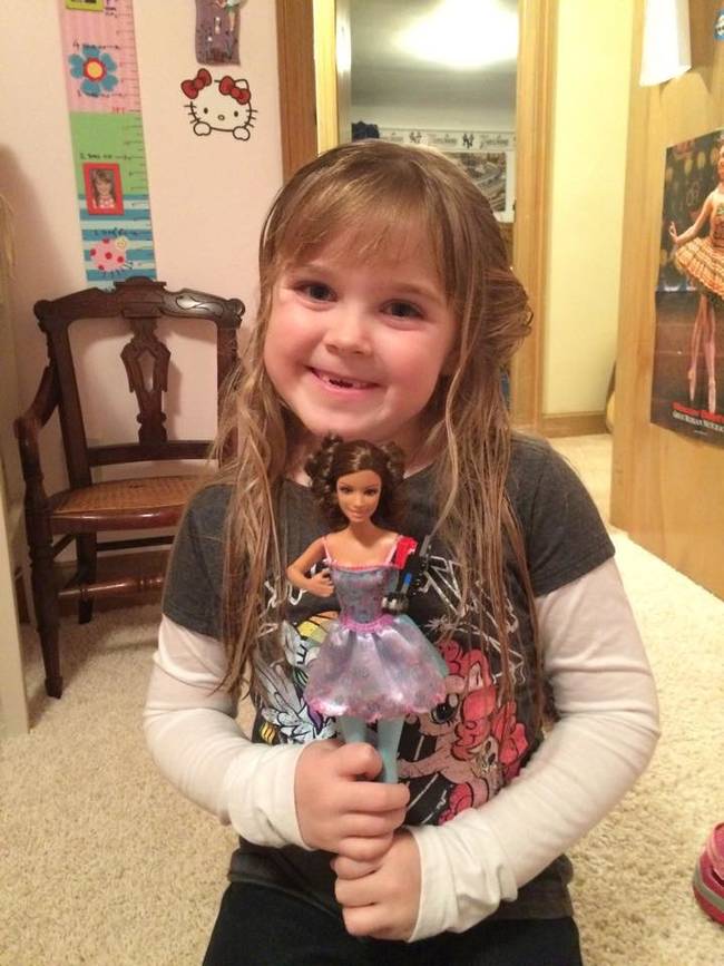 And the man's daughter certainly seems happy with her new and improved doll.