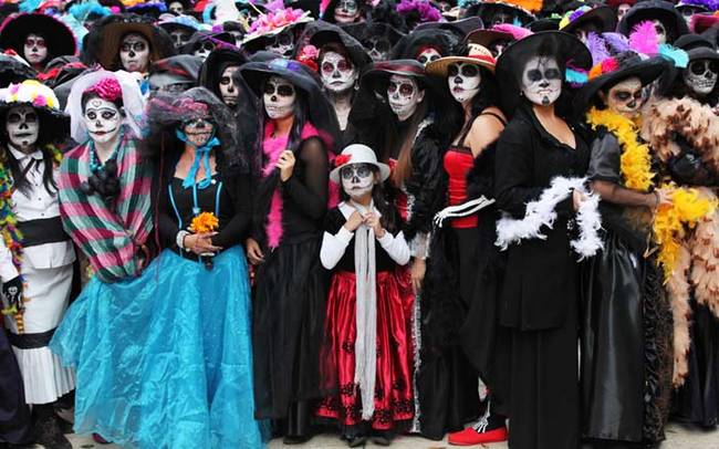 Here is a gathering of women dressed like La Catrina attempting to break a world record during the holiday for the most La Catrinas gathered in one place.