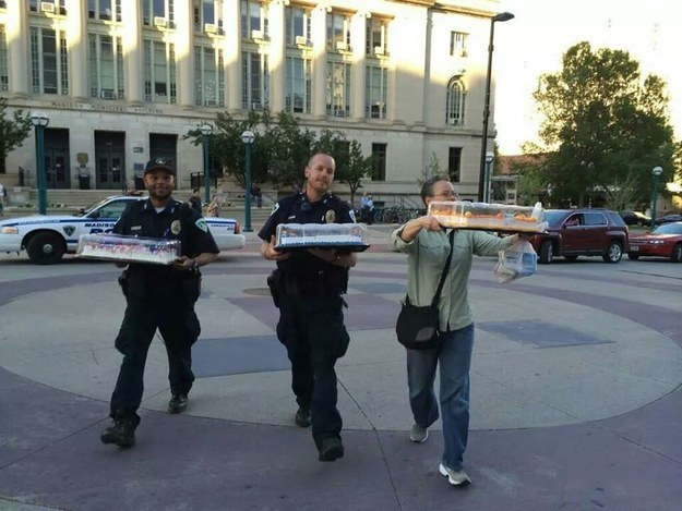 13. Two cops bring cake to newlyweds after Wisconsin’s ban on same-sex marriage was found unconstitutional.