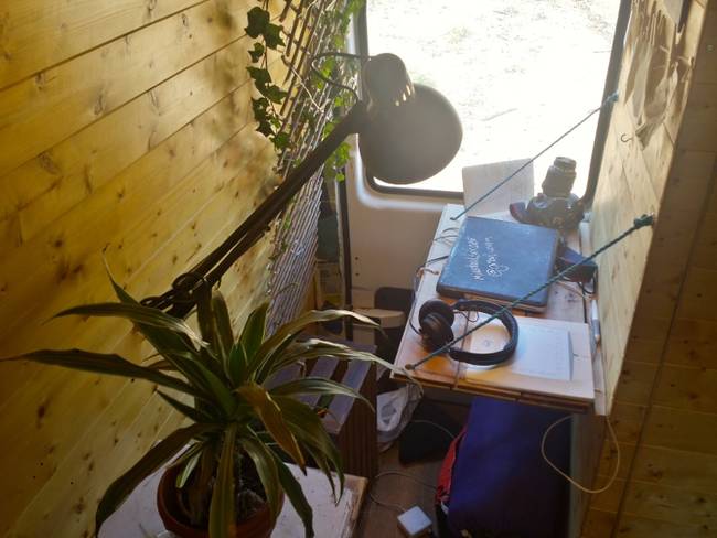 He built a collapsible desk area where he could do some work.