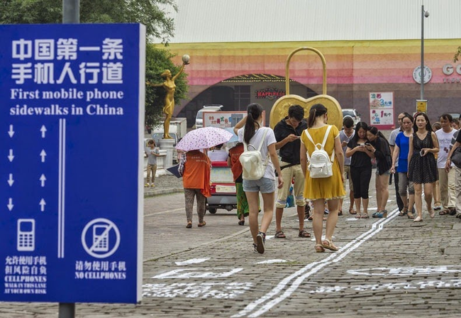 Those who weren't looking at their phones appreciated the first phone sidewalks in China, but many pedestrians were too busy looking at their phones to even notice the lanes.