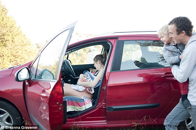 When her husband saw the contractions were coming faster and about 4 minutes apart, he packed up the car and got ready to leave. He also notified the birth photographer, Breanna Gravener that the baby was coming.