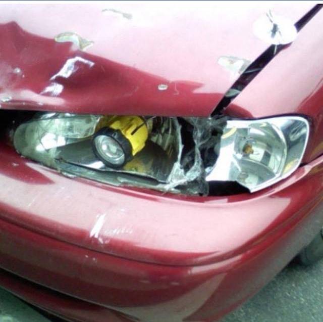 New headlights can be pricey - which is probably why there is a handheld flashlight jammed into the front of this car.