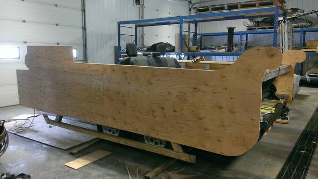 He then constructed the facade of the sleigh float out of plywood.