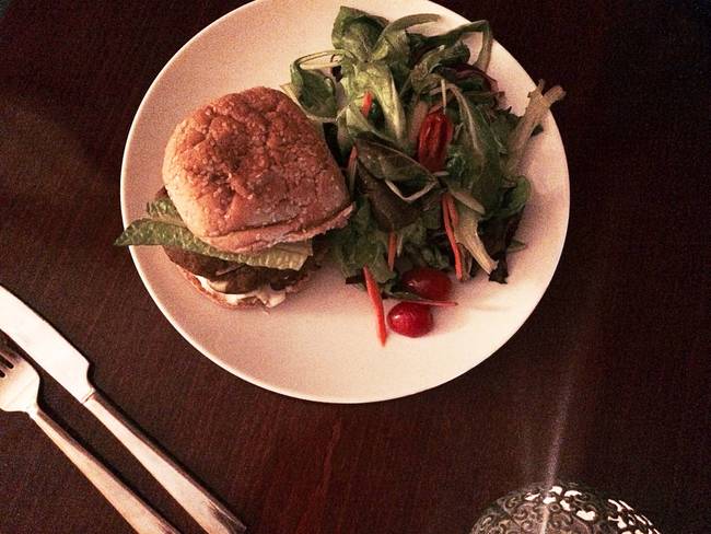 She munched on a homemade veggie burger with sun dried tomatoes and a tangy side salad.