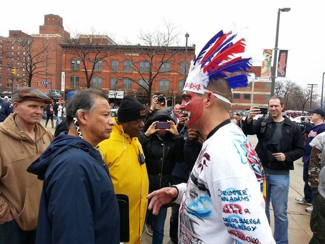 A Cleveland Indians fan, dressed up, meets a real Native American. I wonder how this conversation went?