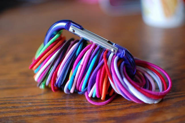 2.) Keep your hair ties together with a carabiner.