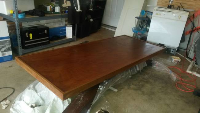 He started out by refinishing this old tabletop.