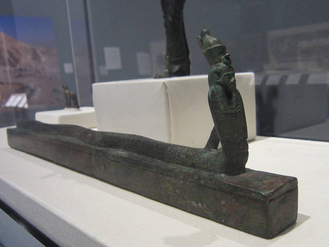 A snake coffin with a decorative head. 664-30 BCE.