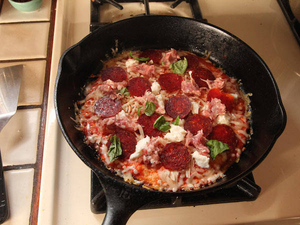 4.) Begin putting on more sauce and cheese and any other toppings you might want on your pizzadilla.