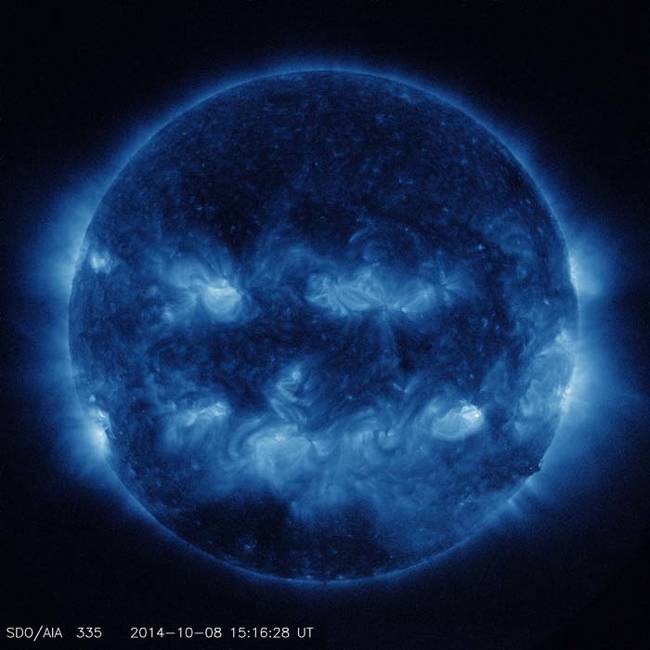 This is what the Halloween sun looks like in ultraviolet light. The lighter areas of the sun in these pictures are active, high energy spots emitting more light.