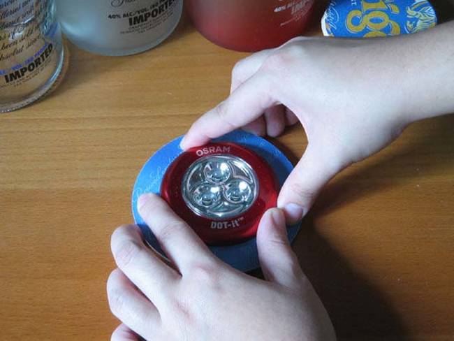 Glue the coasters together and put the light on the inside of the coasters.