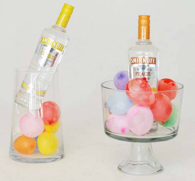 2. Fill clear ice buckets with <a href="https://anthologymag.com/blog3/2013/07/22/its-party-time/" target="_blank">frozen water balloons</a>, instead of ice, to keep bottles of liquor and champagne cold.