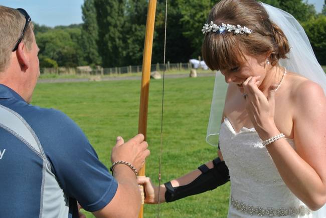 In China, grooms shoot their brides with three (blunted) arrows and then break them. We're not sure why.