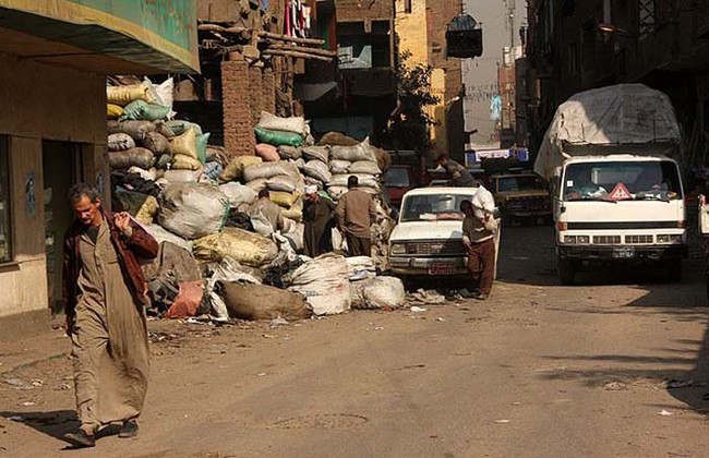 The trucks come and leave the garbage in the district. It's become a way of life for the residents there.