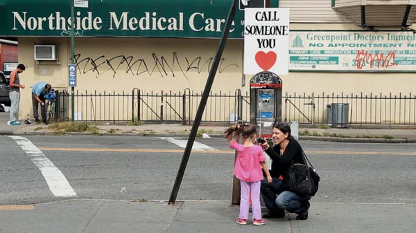 This little girl was excited, she never used a pay phone before.